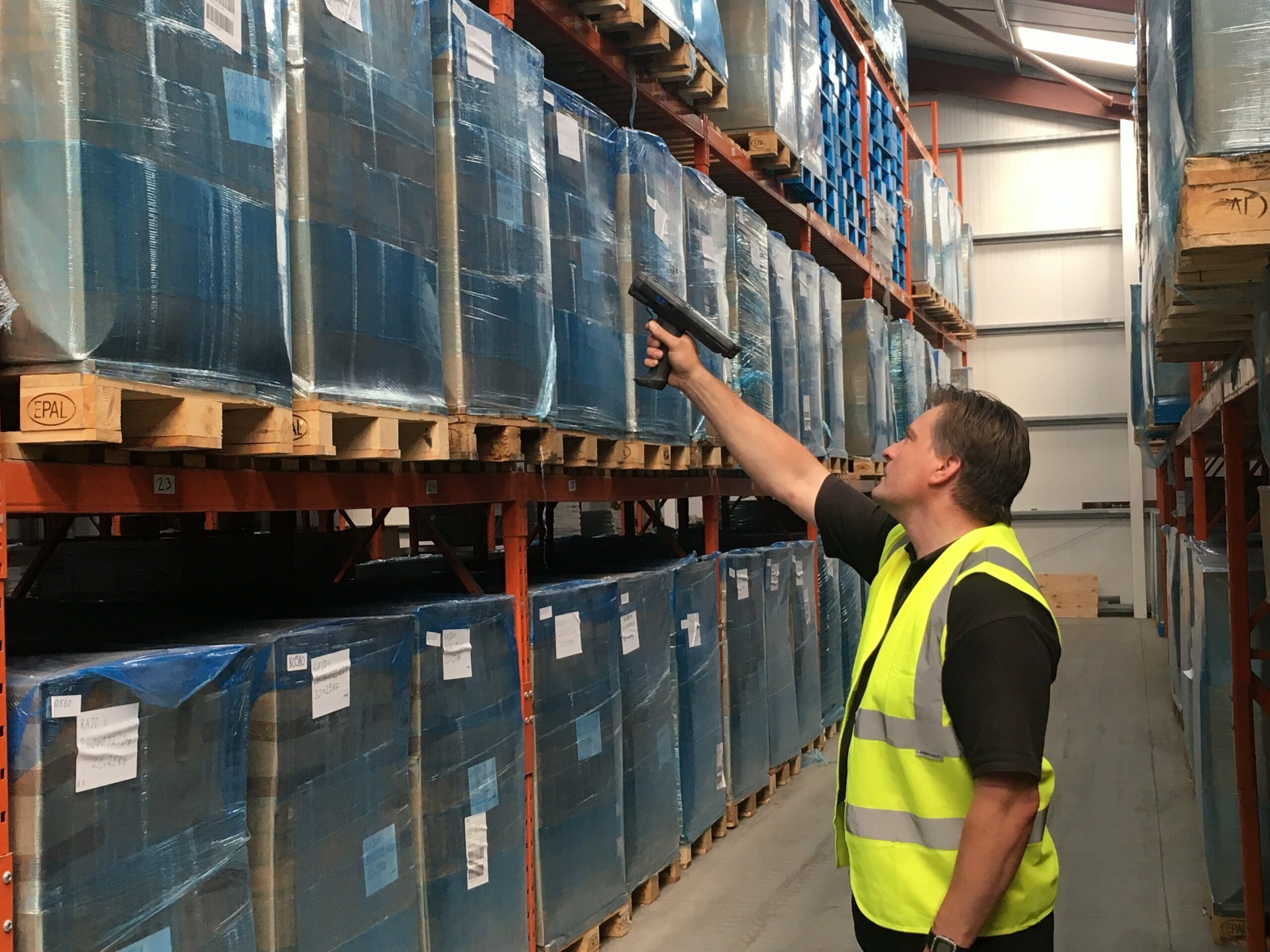A man scanning a pallet stored in a Mars-Jones Warehouse in North Wales